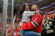 The First Couple of Chicago wrestling take in a Blackhawks game together.